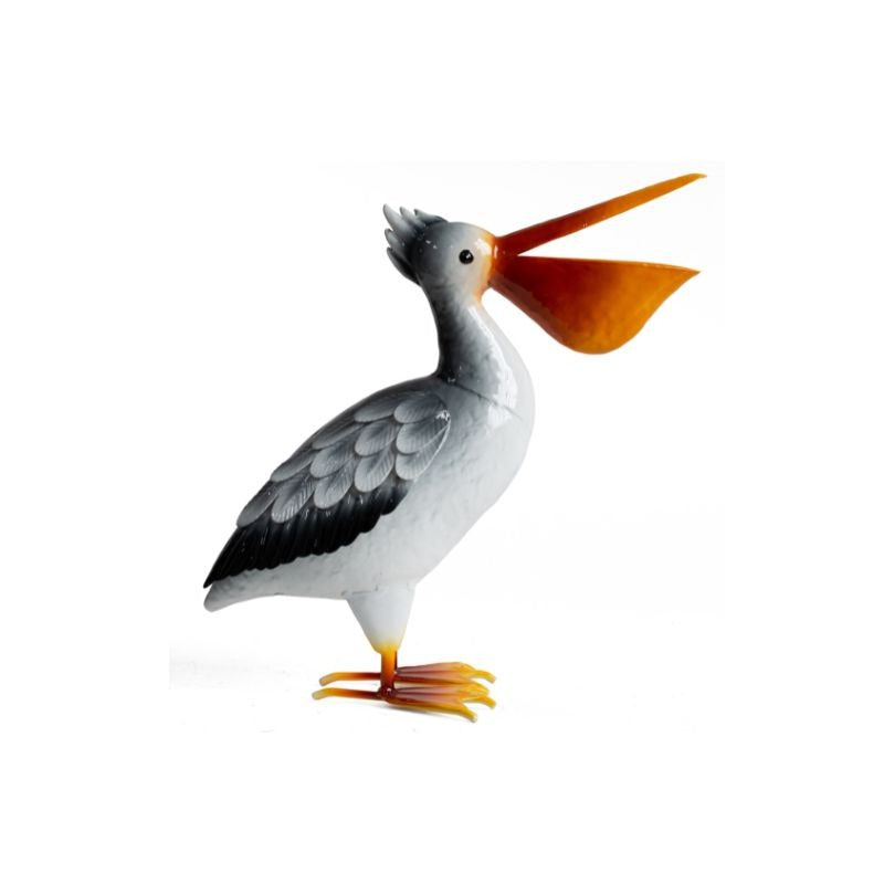 Pelican figurine with a large orange beak on a white background