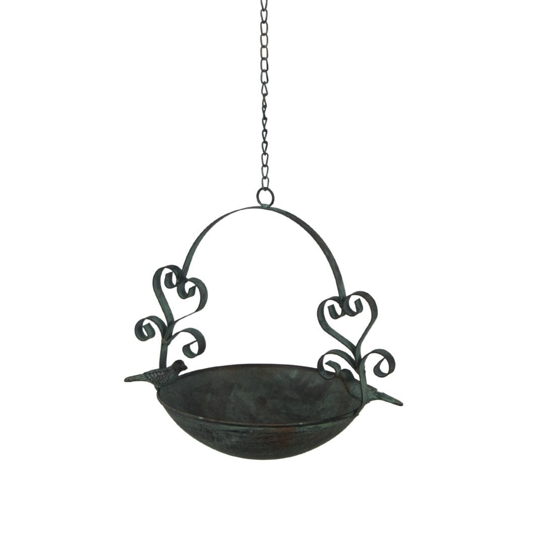 Decorative hanging bird bath with floral designs on a white background